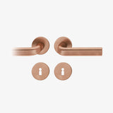 FSB 1242 Drückergarnitur von John Pawson mit Rundrosetten in Bronze 7615 hell patiniert, freigestellte Produktansicht.