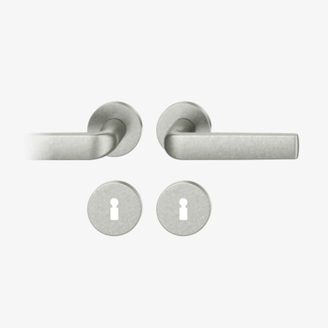 FSB 1267 Drückergarnitur von Mies van der Rohe mit Rundrosetten in Aluminium Pure 0013, freigestellte Produktansicht.